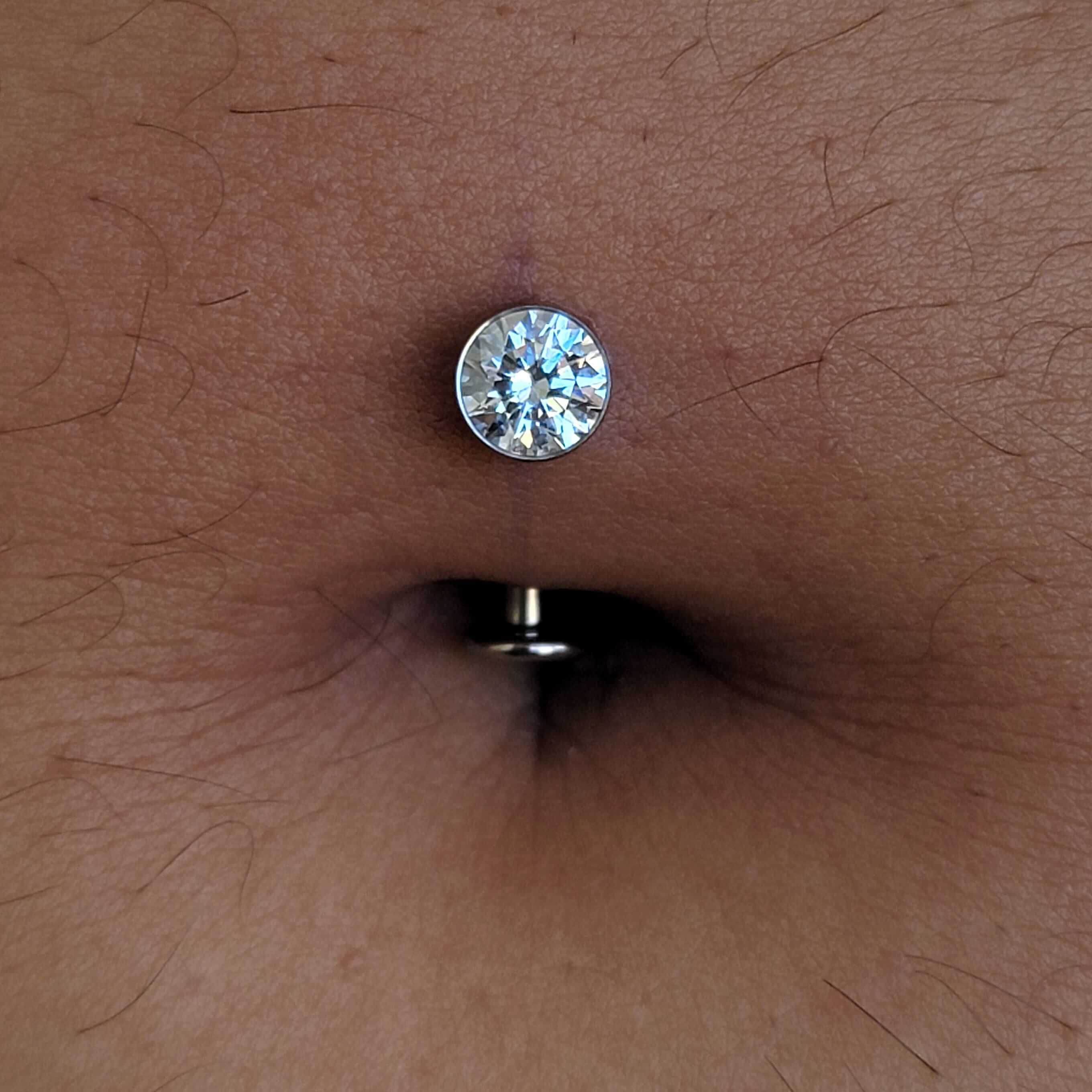 Floating navel piercing done with implant grade titanium