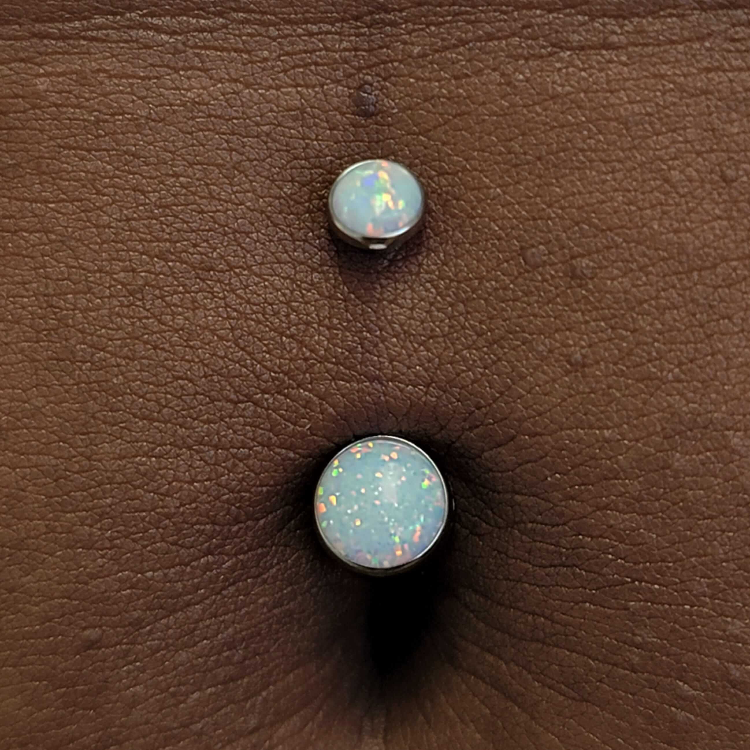 Navel piercing with implant grade titanium and white opals