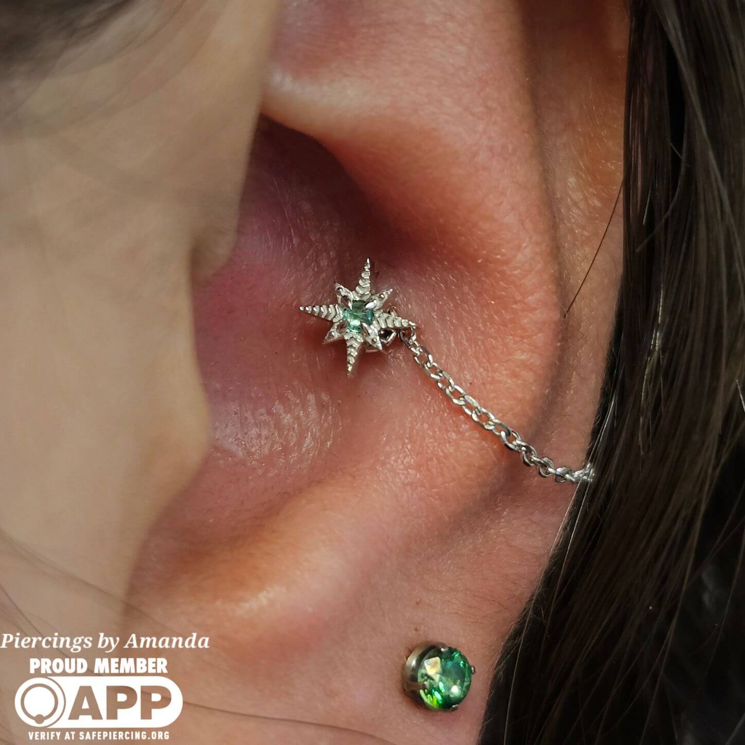 Amanda installed this 14k white gold star with an emerald in a healed conch and adorned it with a 14k white gold chain custom made in house